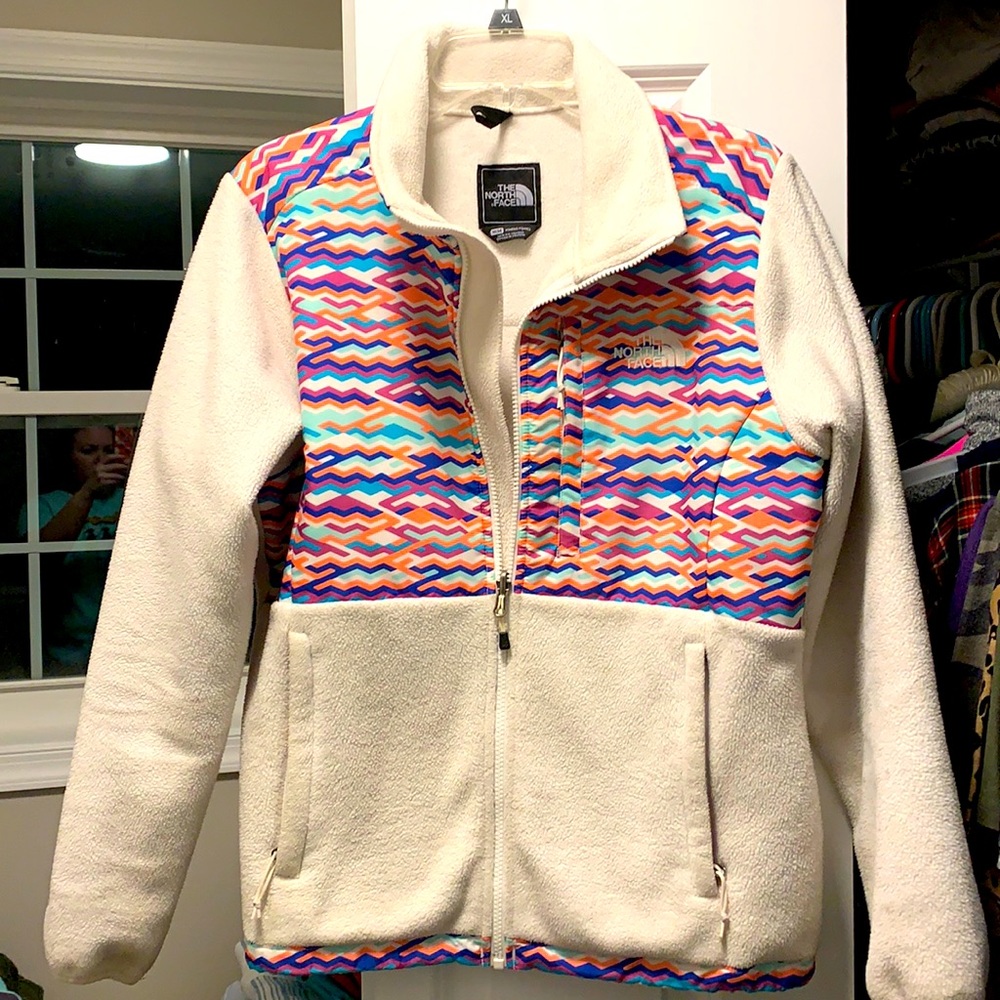 The North Face winter white and multi colored jacket, size medium.